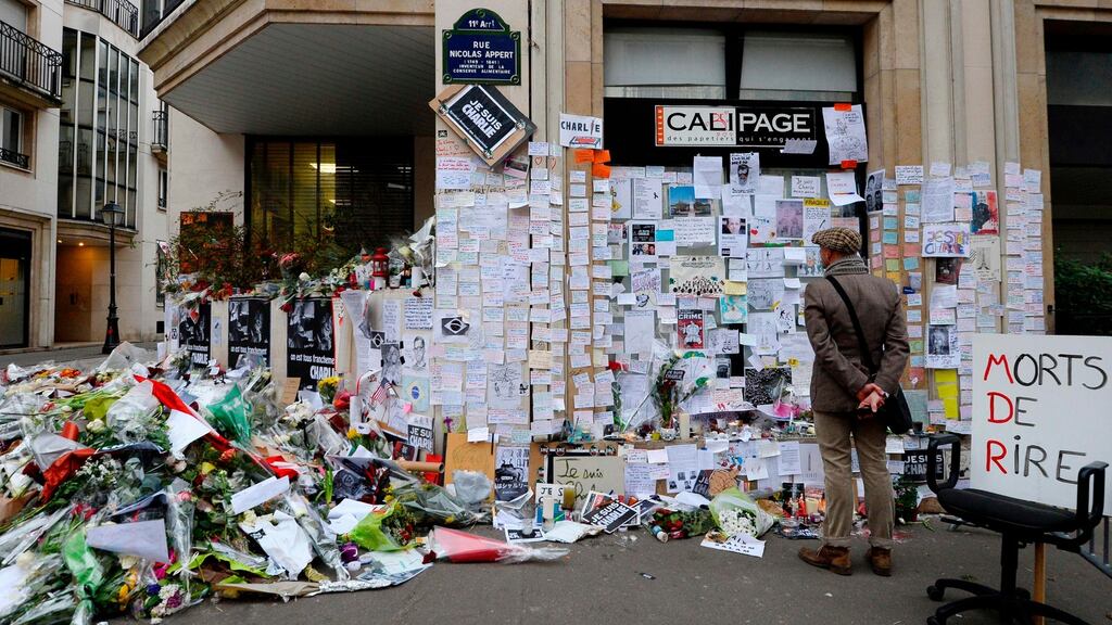 A makeshift memorial near the headquarters of the French satirical weekly ‘Charlie Hebdo’ in Paris in January 2015  in tribute to the 17 victims of a three-day killing spree by Islamist terrorists. Photograph: Bertrand Guay/AFP/Getty Images