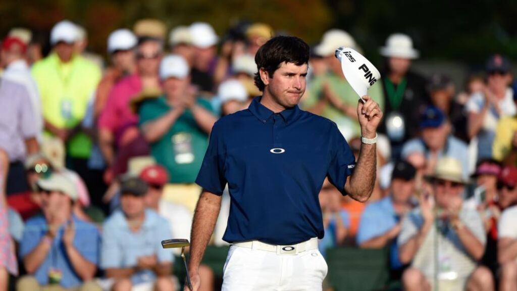 Bubba Watson of the United States waves to the gallery on the 18th green after the third round of the US Masters at Augusta National. Photograph: Harry How/Getty Images
