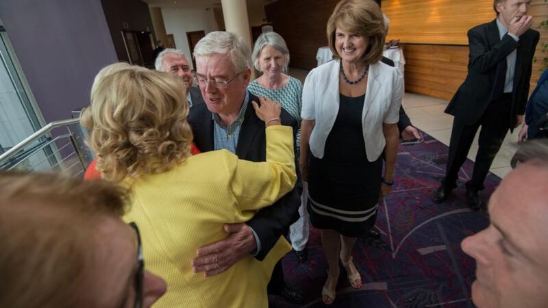 Labour Party leader and Tánaiste Joan Burton watches former leader Eamon Gilmore with Senator Mary Moran during the party’s pre-autumn parliamentary meeting held at White’s Hotel, Wexford. Photograph: Brenda Fitzsimons/The Irish Times