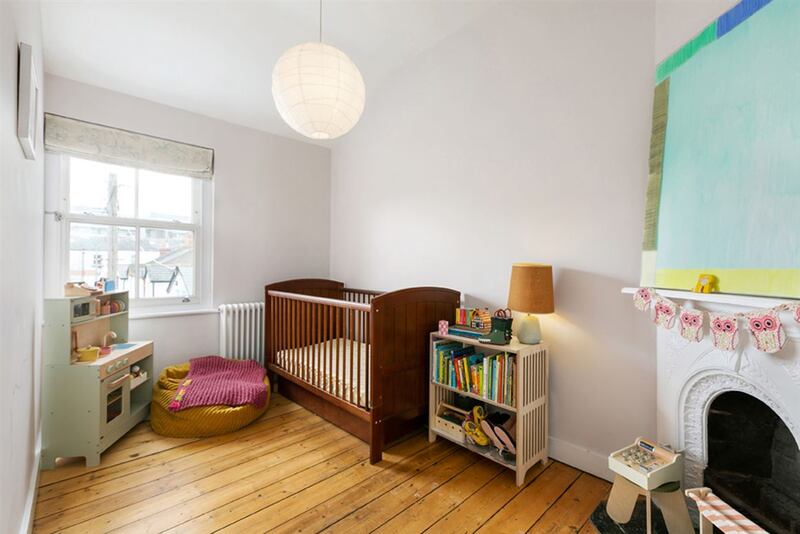 The second smaller bedroom, currently used as a nursery, would make a decent single room.
