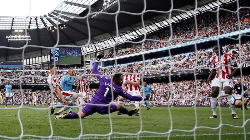 David Silva puts Manchester City 3-0 up against Stoke City. Photograph: Andrew yates/Reuters