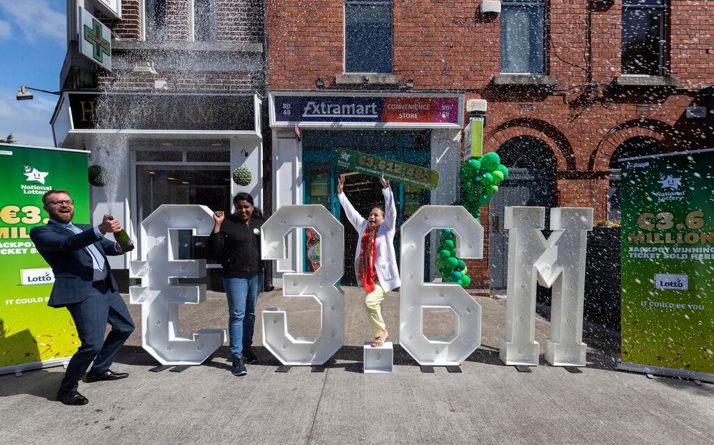 National Lottery sales rep Simon Reenan sprays the champagne as Drumcondra shop owner Sofi Bequm, centre, and shop assistant, Seethal Antony celebrate selling a winning €3.6 million Lotto ticket. The Lottery's sales exceeded €1 billion last year for the first time. Photograph: Colin Keegan, Collins Dublin