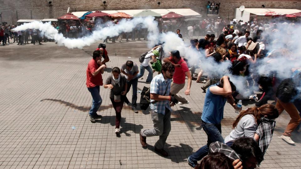 Riot police use tear gas to disperse the crowd at Taksim Square. Photograph: Murad Sezer/Reuters
