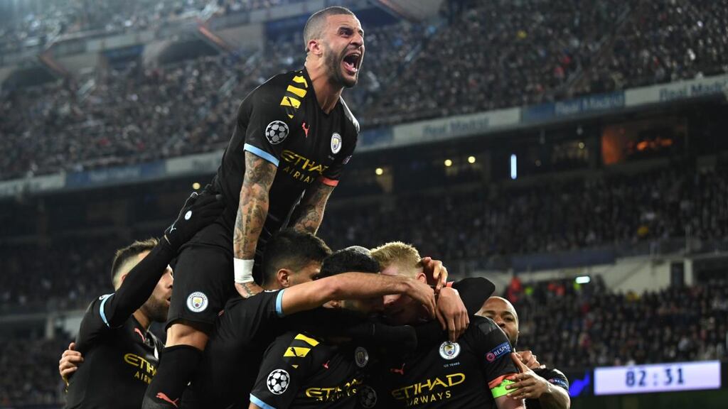 Kyle Walker joins in as Kevin De Bruyne of  celebrates with team-mates after scoring his team’s second goal during the  Champions League round of 16 first leg match against  Real Madrid  at the  Bernabeu. Photograph: David Ramos/Getty Images