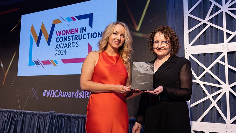 Claire Mockler, account manager, SIG Workplace, presents the best sustainability leadership award to Helena McElmeel, Helena McElmeel Architects