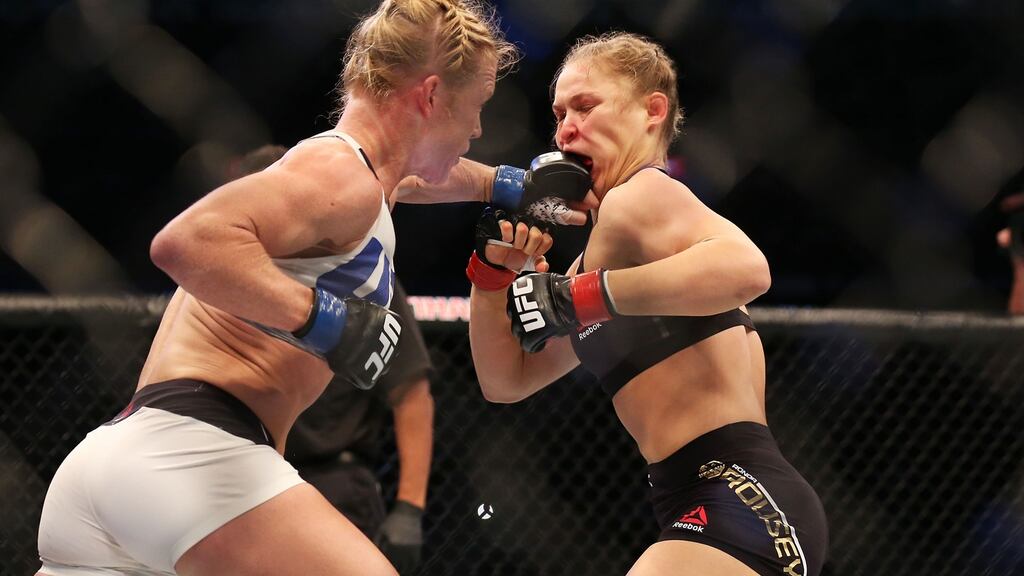 Holly Holm lands another big left to Ronda Rousey’s face during the UFC women’s bantamweight championship bout during the UFC 193 event at Etihad Stadium in Melbourne. Photograph: Quinn Rooney/Getty Images
