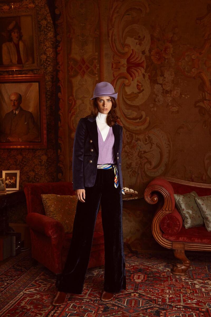 Lilac jumper with polo neck detail (€165 Sandro, Brown Thomas), velvet blazer (€100 River Island), velvet trousers (€170 Marella, Arnotts), ‘Daisy Chain’ silk scarf worn as belt (€85 Susannagh Grogan), pink velvet ankle boots (€46 lulus.com), lilac hat (€170 Anthony Peto)