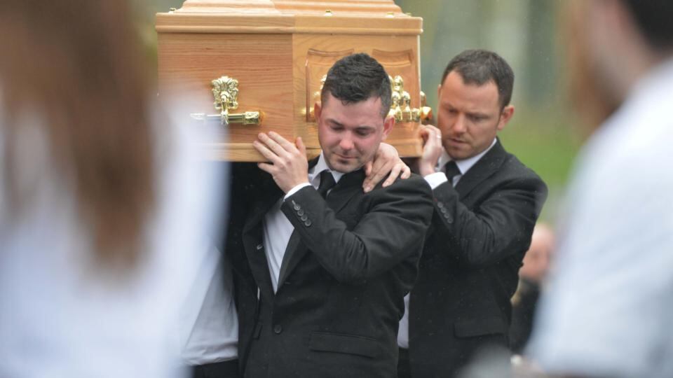 Brothers of Karen Buckley carry her remains past a guard of honour of colleague nurses from the University of Limerick, at her funeral at St Michael’s, Analeentha, Co Cork. Photograph: Michael Mac Sweeney/Provision