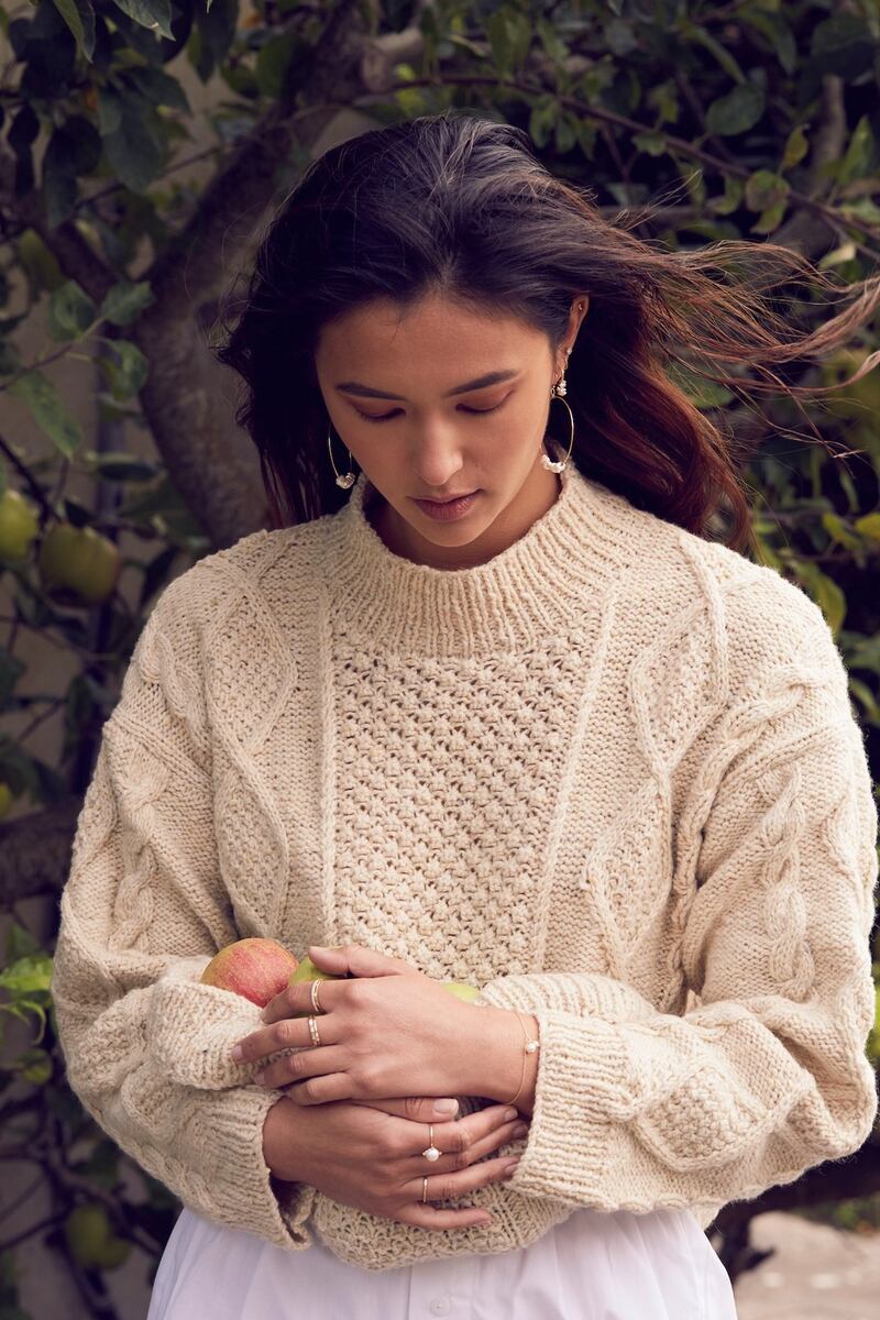 Cream hand knit Aran jumper €480 from Stable (stableofireland.com) with rings, earrings and bracelets from MoMuse (momuse.ie)