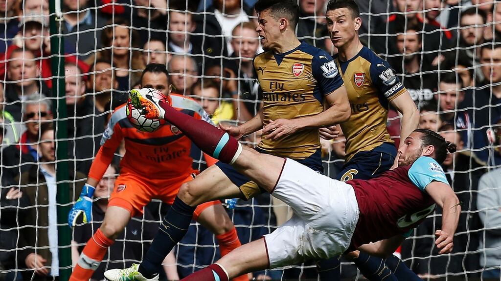 West Ham United’s Andy Carroll (R) shoots to score his team’s second goal against Arsenal last weekend. Photo: Getty Images