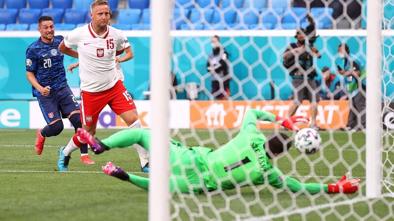 Poland’s goalkeeper Wojciech Szczesny divertes the ball into his own goal during the Euro 2020 game against Skovakia in St Petersburg. Photograph: Lars Baron/EPA