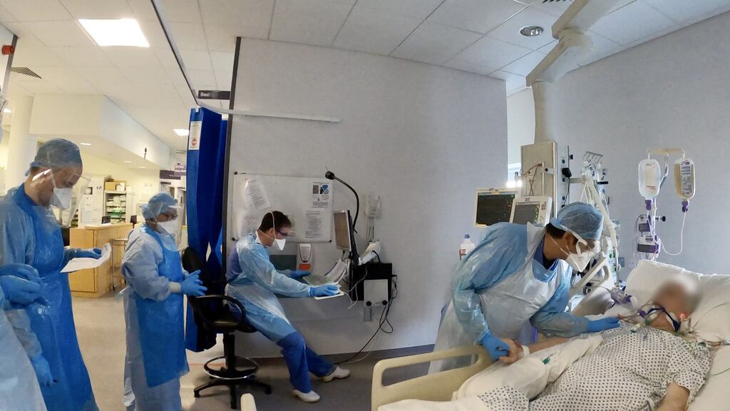 Medical staff in PPE work on a Covid patient in the ICU at St Vincent’s hospital in Dublin. Photograph: Alan Betson