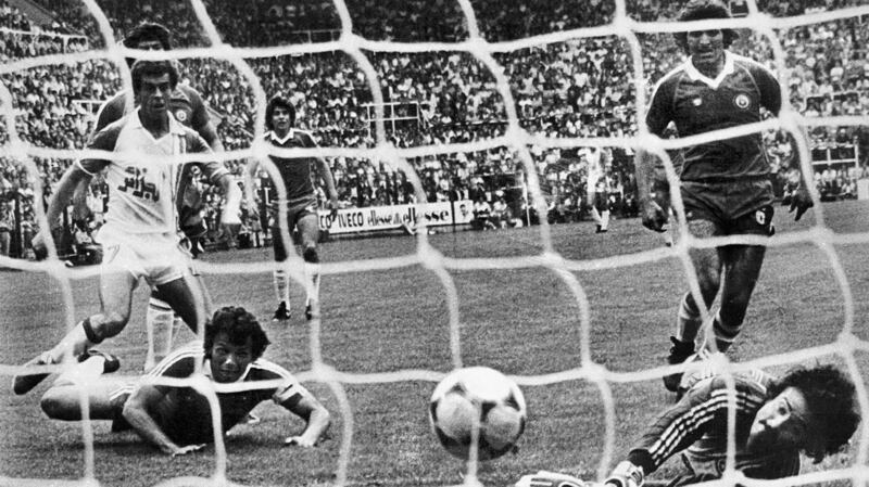 Algerian forward Salah Assad (L) scores his second goal against Chile. Photograph: Staff/Getty