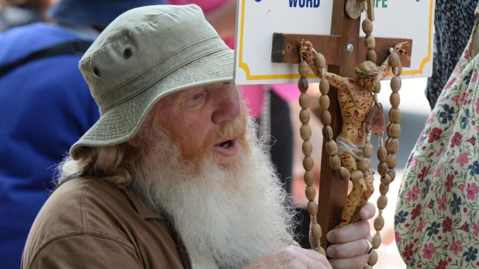 An anti-abortion protester prays outside the Dáil as the debate continues over the abortion Bill. Photograph: Alan Betson/The Irish Times