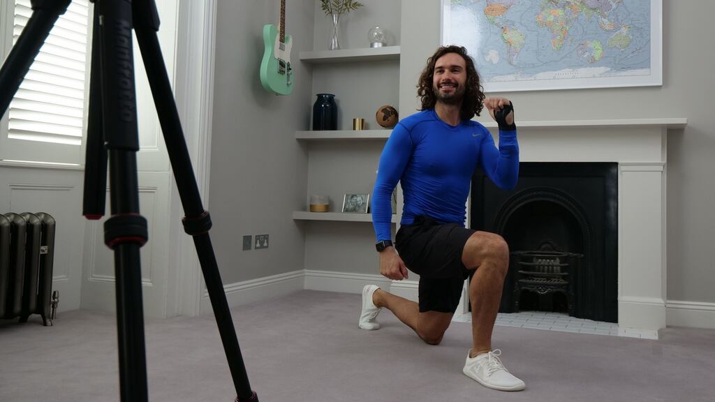 Joe Wicks, aka The Body Coach, teaches the school children physical education live through YouTube from his home in London, England. Photograph: The Body Coach/Getty Images