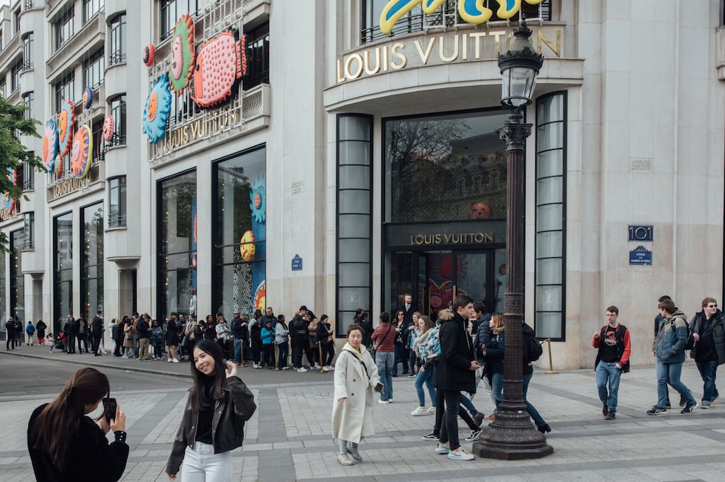 Shoppers at the Louis Vuitton store on the Champs Elysee in Paris. The French economy grew more than expected in the second quarter. Photograph: Cyril Marcilhacy/Bloomberg