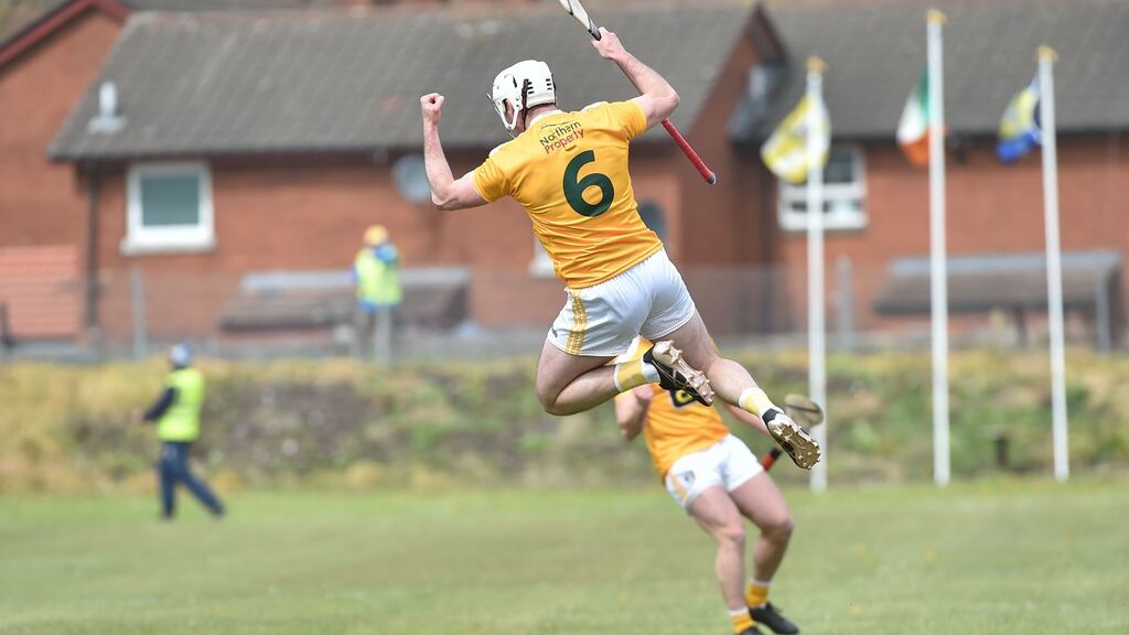 Antrim players celebrate at the final whistle after victory over Clare in the league clash at Corrigan Park in Belfast. Photograph:  Colm Lenaghan/Pacemaker