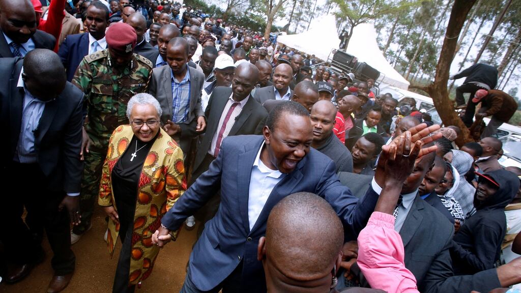 President Uhuru Kenyatta is greeted by supporters after casting his vote in the Kenyan election in his home town of Gatundu in Kiambu county, on Tuesday. Photograph: Baz Ratner/Reuters