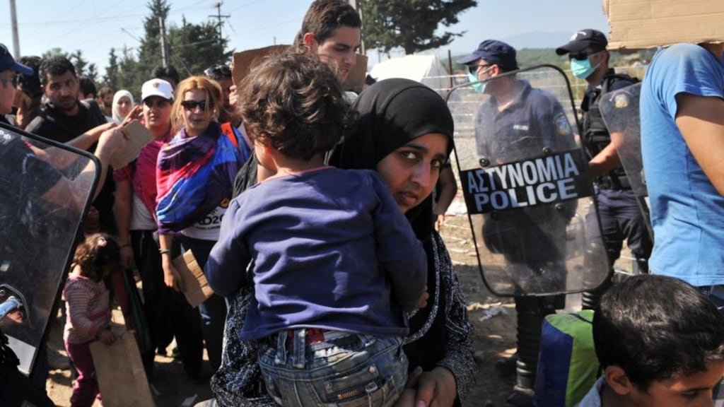 Migrants wait to cross Greek Macedonian border near the town of Idomeni, Northern Greece. Photograph: Sakis Mitrolidis/AFP/Getty Images
