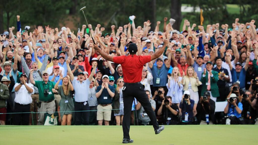 Tony Finau congratulates Tiger Woods on his win after the final round of the Masters at Augusta National Golf Club. Photograph: Andrew Redington/Getty Images