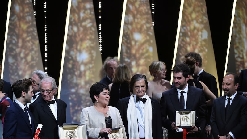 Grand-Prix winner Canadian director Xavier Dolan, Palme d’or winner British director Ken Loach, best actress Jaclyn Jose, Honorary Prize winner French actor Jean-Pierre Leaud, best actor Shahab Hosseini and best screenplay winner Asghar Farhadi pose on stage at the end the closing ceremony of the 69th Cannes Film Festival. Photograph: Alberto Pizzoli/AFP/Getty Images