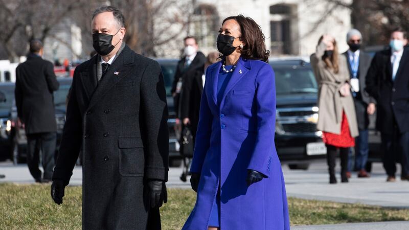 Vice President-elect Kamala Harris in an outfit by Christopher John Rogers and her husband Douglas Emhoff in Ralph Lauren arrive at the United States Capitol. Photograph: EPA/Rod Lamkey
