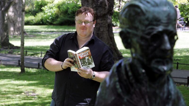 Derek Landy, author of Skulduggery Pleasant, which won the Bord Gáis Energy Irish Book of the Decade competition, with the James Joyce bronze bust in St Stephen’s Green. Photograph: Cyril Byrne