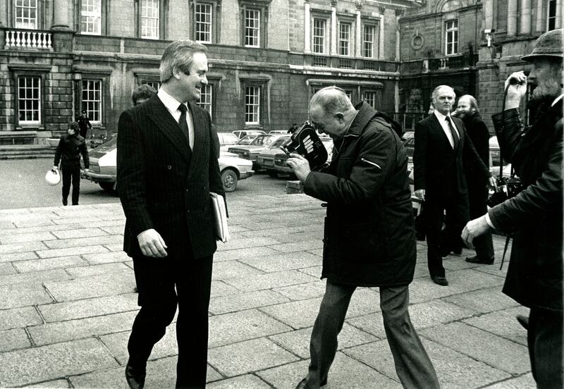 John Bruton, as a young Fine Gael minister for finance, has his shoes filmed by RTÉ cameraman Jack Merriman on the Dáil plinth before going into the House to announce the imposition of VAT on shoes as part of the budget. Photograph: Eamonn farrell/RollingNews.ie