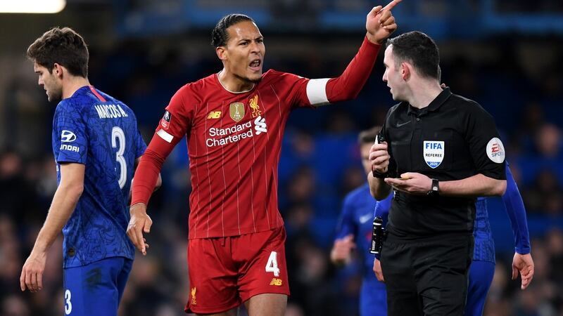 Virgin van Dijk and Liverpool are two victories from the title. Photograph:Shaun Botterill/Getty
