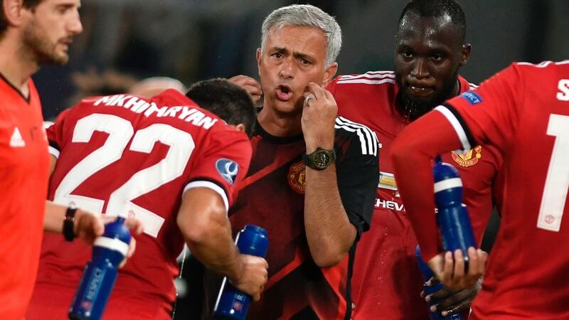 Jose Mourinho during one of two water breaks taken in Sweltering conditions in Skopje. Photograph: Nikolay Doychinov/AFP
