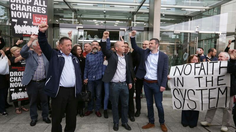 Jobstown trial defendants Michael Banks, Ken Purcell, Paul Murphy TD and Scott Masterson leave the Dublin Circuit Criminal Court after they were all found not guilty on charges of the false imprisonment of then tánaiste Joan Burton at a water protest in 2014. Photograph: Collins Courts
