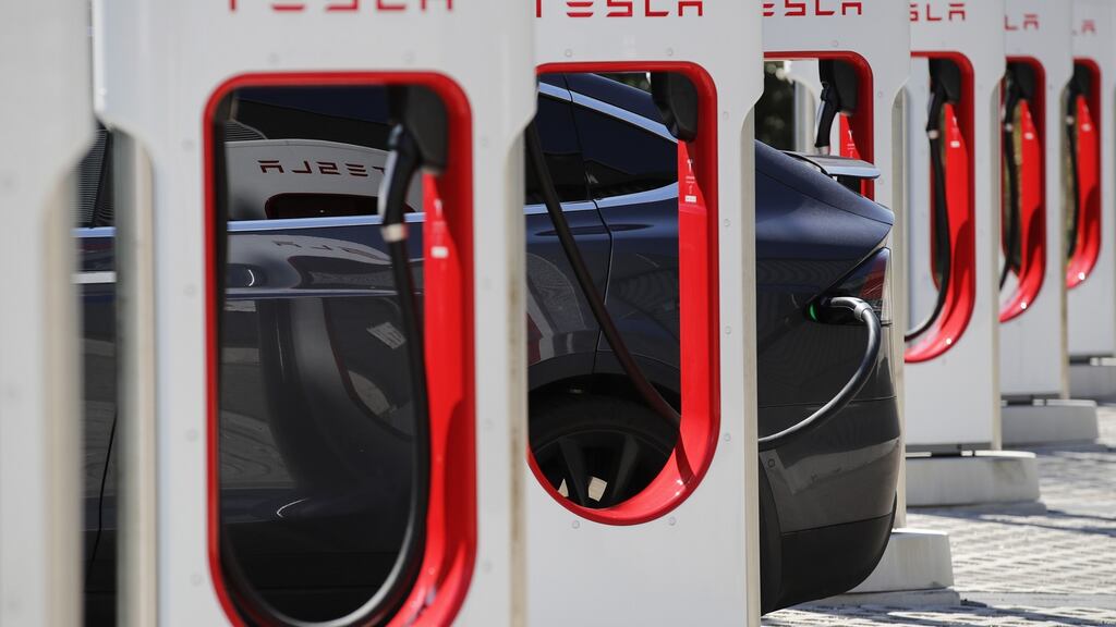 A Tesla Model S electric vehicle recharging. Tesla chief executive Elon Musk’s inability to avoid controversy hasn’t helped the share price of electric car company recently. Photograph: Stefan Wermuth/Bloomberg