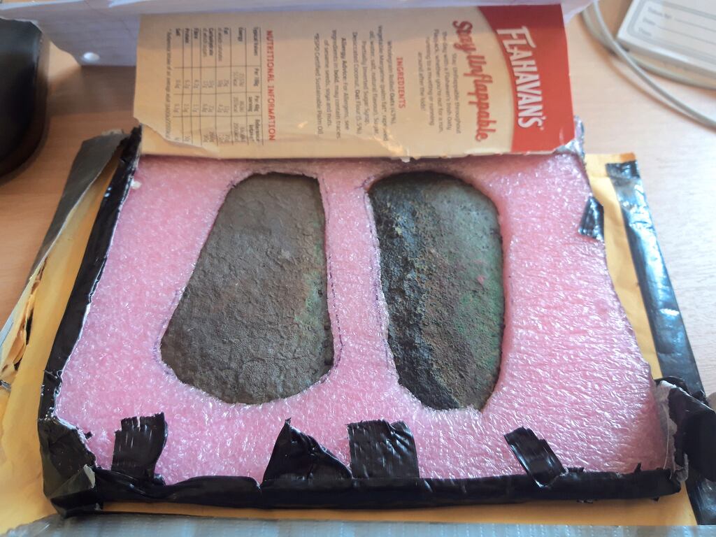 Bronze Age axe heads found by a Westmeath farmer are packed in foam inside a porridge box on arrival at the National Museum of Ireland.