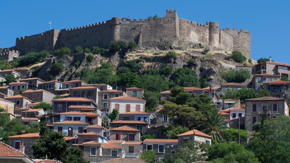 The Lesvos hilltop town of Molyvos with its medieval hilltop fortress: it can barely cope with the surge in the numbers of refugees and undocumented migrants. Photograph: Nikolas Georgiou