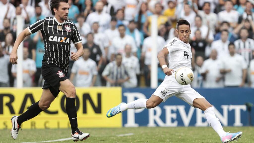 Neymar (right) has finally left Santos to join Barcelona. Photograph: Getty Images