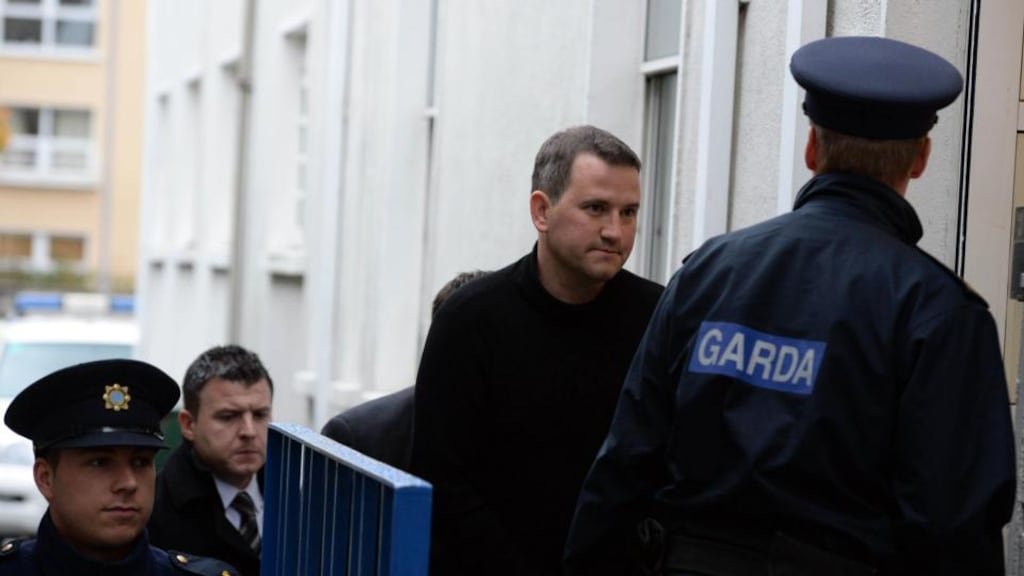 Graham Dwyer (centre in black) being brought into Dun Laoghaire District Court this morning where he was charged with the murder of Elaine O Hara. Photograph: Cyril Byrne/The Irish Times