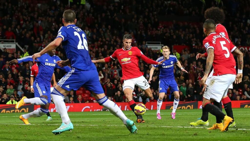 Robin van Persie of Manchester United scores the equalising goal during the  Premier League match against  Chelsea at Old Trafford. Photograph: Alex Livesey/Getty Images