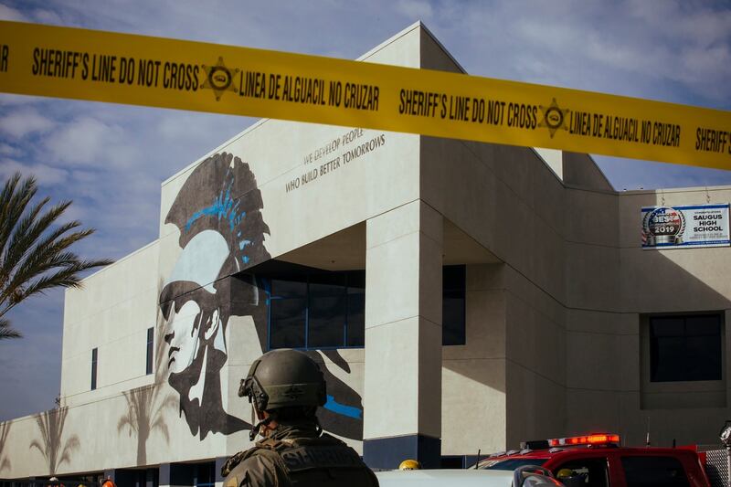 Law enforcement and emergency personnel respond to the incident at the high school. Photograph: David Walter Banks/The New York Times