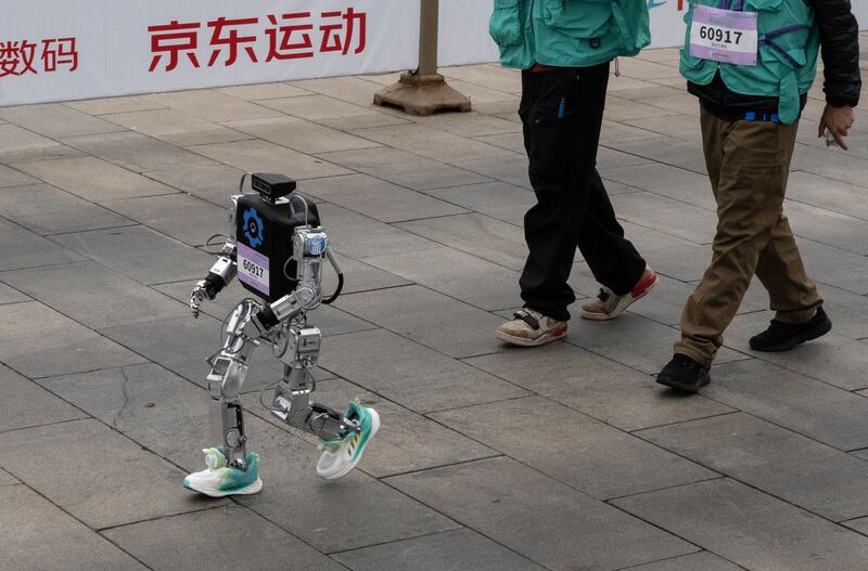 A humanoid robot in running shoes in the Beijing E-Town Humanoid Robot Half Marathon. Photograph: Kevin Frayer/Getty Images