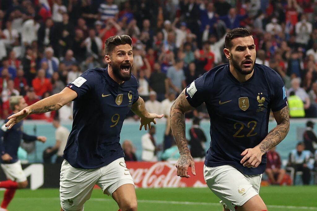 France's Theo Hernandez runs to celebrate his goal against Morocco with Olivier Giroud in hot pursuit. Photograph: Adrian Dennis/AFP via Getty Images