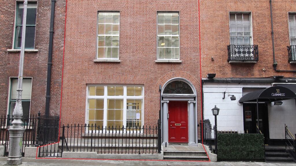 46 Kildare Street: presented in good decorative order, with many original features, including decorative cornice and coving with feature exposed brick walls