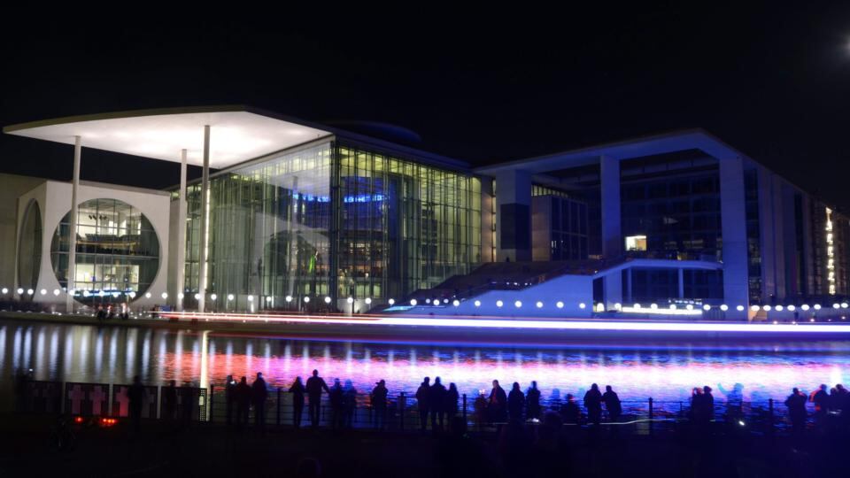 Balloons on poles of the ‘Border Of Lights 2014’ installation are reflected in the river Spree early this morning. Photograph: Rainer Jensen/ EPA
