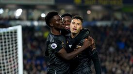 Arsenal survive late Brighton revival to extend lead at the top