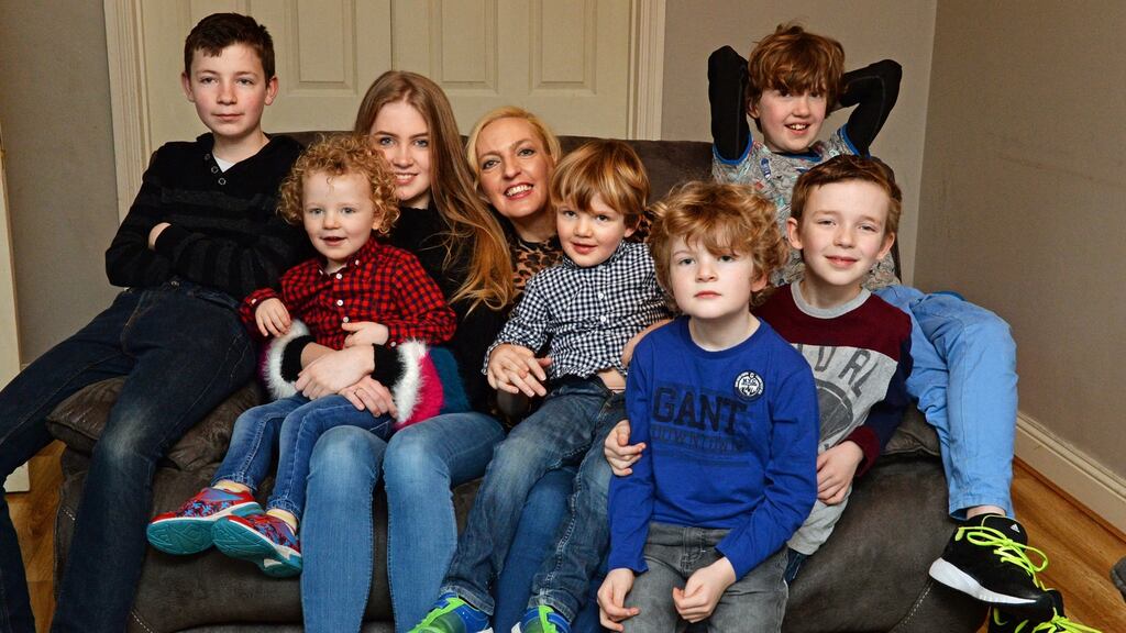 Jen Hogan with her daughter Chloe and sons (L-R) Adam, Noah, Zach, Tobey, Luke and Jamie at home in 2018. Photograph:  Cyril Byrne/The Irish Times
