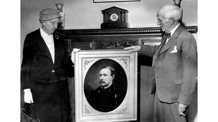 A portrait of Lawrence Knox being presented by his niece Kathleen Dobbs to the chairman of The Irish Times Frank Lowe in 1945