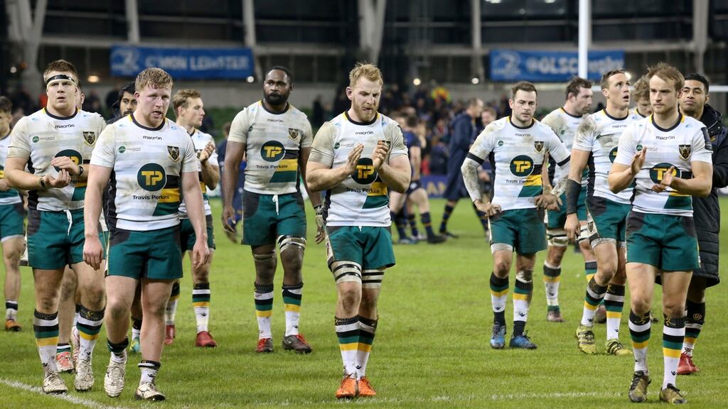 Dejected Northampton Saints troop off after their heavy defeat to Leinster at the Aviva Stadium. Photograph: Ken Sutton/Inpho
