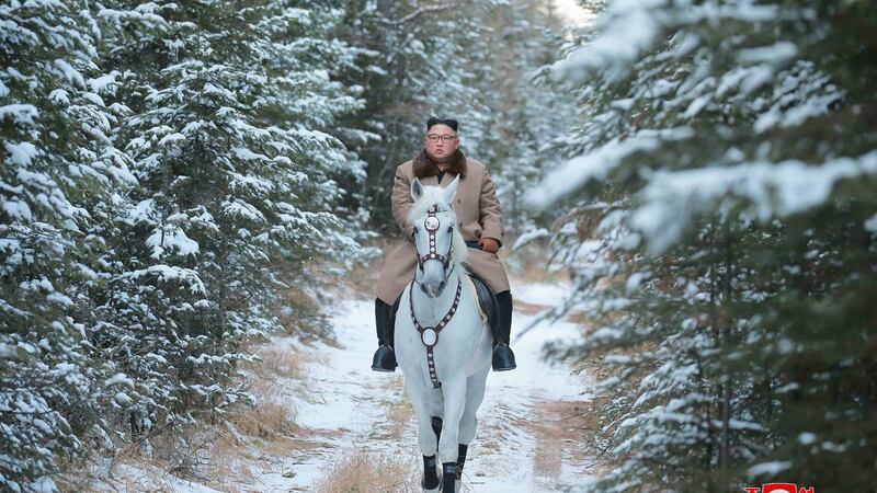 North Korean leader Kim Jong Un rides a white horse to climb Mount Paektu, North Korea. Photograph: Korea News Service/AP.