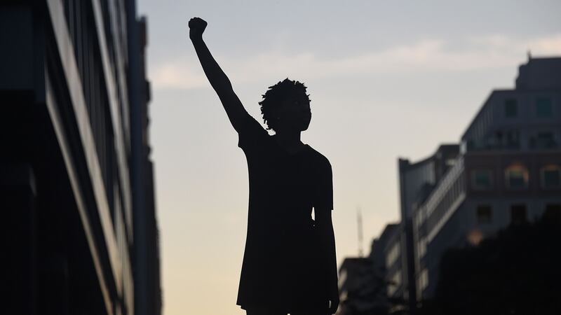 A demonstrator during a protest in Washington DC on Sunday against police brutality and the death of George Floyd. Photograph: Olivier Douliery/AFP via Getty Images