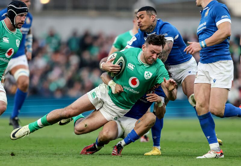 Ireland’s Hugo Keenan is tackled by Ange Capuozzo during the victory over Italy at the Aviva Stadium. Photograph: Dan Sheridan/Inpho