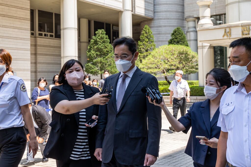 Members of the media surround Lee Jae-yong, co-vice chairman of Samsung Electronics outside the Seoul central district court on Friday. Photograph: SeongJoon Cho/Bloomberg